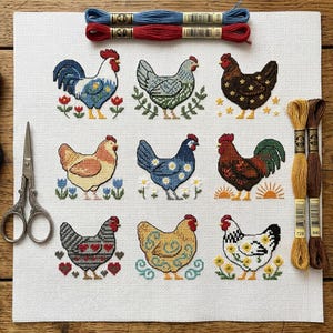 May include: A white Aida fabric cloth featuring a cross-stitch pattern of nine distinct chickens in various colors and floral motifs. The embroidery is accompanied by two blue and red embroidery floss skeins above and two gold and brown skeins to the right.