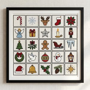 May include: Framed artwork featuring a grid of 25 Christmas-themed cross-stitch designs. Each square showcases a different festive symbol, including a candy cane, snowflake, reindeer, stocking, poinsettia, angel, gift, star, candle, nutcracker, Christmas tree, mistletoe, gingerbread man, sleigh, icicles, wreath, dove, ornament, snowman, lantern, Santa hat, bell, holly, pinecone, and star.