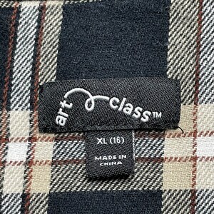 May include: A black and white plaid shirt with a black label that says "art class" and "XL (16)". The label also says "Made in China".