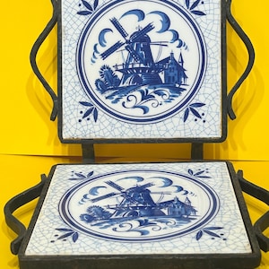 May include: A white ceramic mug with a black handle and the text "But First, Coffee" in a bold, black font. The mug is sitting on a wooden surface. The mug is approximately 4 inches tall.