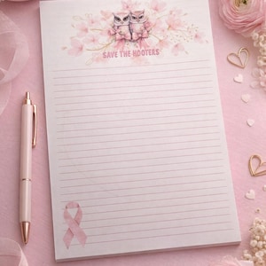 May include: Pink notepad with lined pages, featuring a floral design with two owls and the text "SAVE THE HOOTERS." A pink ribbon symbol is in the corner. A pink pen and decorative elements are also present.