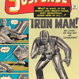 以下が含まれることがあります： 「Tales of Suspense」のヴィンテージコミックの表紙、アイアンマンが特徴です。表紙には赤と黄色のタイトルバナーがあり、「Iron Man！」の文字が大きく太字で書かれています。コミックはヴィンテージスタイルです。