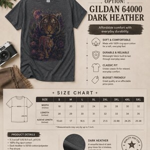 May include: A dark heather gray short-sleeve t-shirt featuring a graphic of two tigers in a floral landscape. The image includes text detailing the Gildan 64000 model, product features, and a size chart with measurements in inches from S to 5XL.