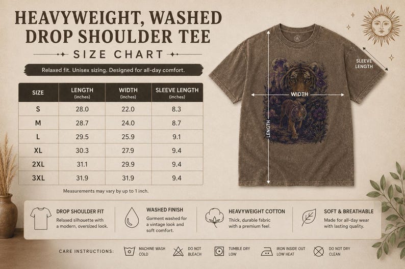 May include: A brown, heavyweight, washed drop shoulder t-shirt featuring a tiger graphic. The image includes a size chart with measurements in inches for sizes S through 3XL, along with icons detailing the garment's fit, fabric, and care instructions.