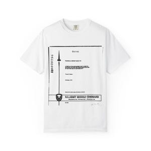May include: White t-shirt with a black and white technical report graphic. The design includes text, a diagram, and the words "U.S. ARMY MISSILE COMMAND". The shirt has a crew neck and short sleeves.