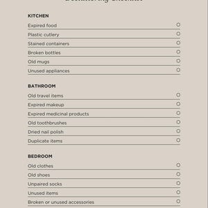 May include: A decluttering checklist from Grace Edit Co. lists items to discard from the kitchen, bathroom, and bedroom. The checklist includes items like expired food, old toothbrushes, and unused items. The text is in a serif font on a beige background.