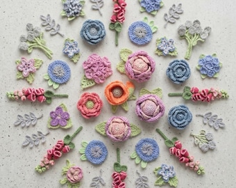 May include: A collection of crocheted flowers and leaves in soft pastel shades of pink, blue, purple, and green arranged in a circular pattern. The text Crochet Soft Palette Flowers pattern and Instant PDF Download are visible on the image.