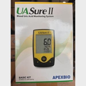 May include: A white box with the text "UA Sure II Blood Uric Acid Monitoring System." The box displays a yellow and black blood uric acid monitor showing a reading of 6.0 mg/dL. The words "BASIC KIT" and "Suitable For Self-testing" are also visible.