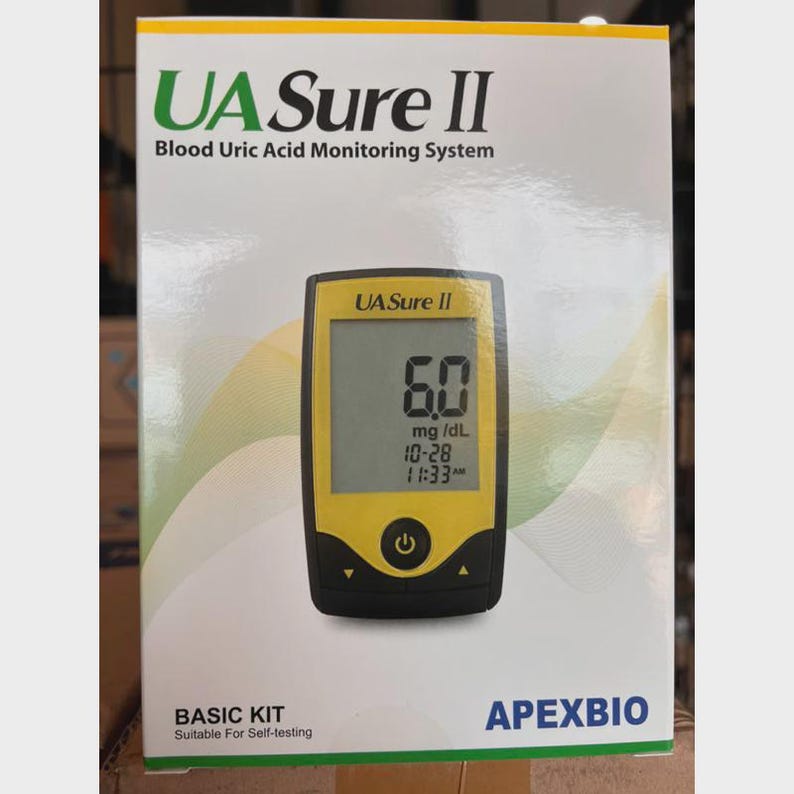 May include: A white box with the text "UA Sure II Blood Uric Acid Monitoring System." The box displays a yellow and black blood uric acid monitor showing a reading of 6.0 mg/dL. The words "BASIC KIT" and "Suitable For Self-testing" are also visible.