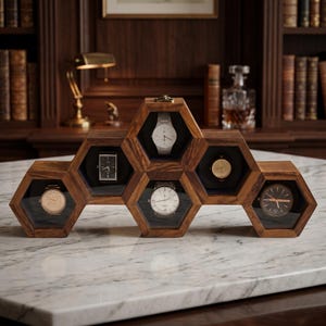 May include: A wooden watch display case with a honeycomb design, showcasing six watches. The case is made of dark wood and features individual compartments with glass covers. The watches have various band and face colors.