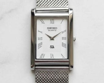 Vintage Seiko tankhorloge, rechthoekige wijzerplaat met Romeinse cijfers | Slanke roestvrijstalen dresswatch