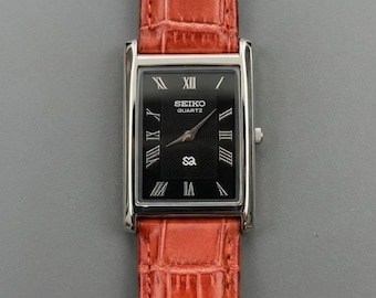 Vintage Seiko zwarte wijzerplaat quartzhorloge voor heren | Leren band| Retro Japans polshorloge gerenoveerd
