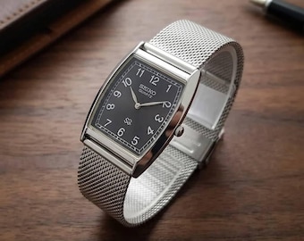 Vintage Seiko slank quartzhorloge | Herenhorloge met zwarte wijzerplaat | Roestvrijstalen armband | Gerenoveerd