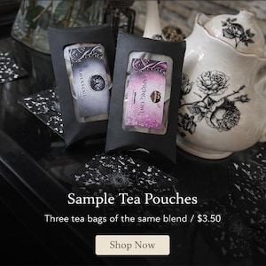 May include: A white ceramic mug with a black handle and the text "But First, Coffee" in a handwritten style. The mug is on a white surface. The mug is approximately 4 inches tall.
