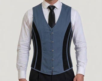 May include: A blue vest featuring black side panels and a front button closure, worn over a white long-sleeved collared shirt with a black necktie and paired with black trousers. The vest has a structured fit with vertical seams.