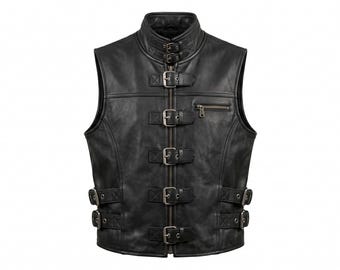 May include: Black leather vest with a high collar and multiple silver buckles. The vest has a zipper pocket on the chest and a zip-up front. The vest is sleeveless and has a classic biker style.