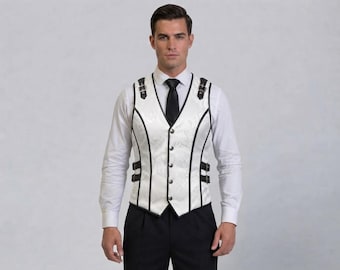 May include: A white vest featuring a subtle tonal pattern, black piping along the seams, and black buckled straps on the shoulders and sides. The vest has a V-neckline with a front button closure, worn over a white long-sleeve shirt and black tie.