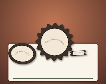 May include: A cream-coloured rectangular card with a dark brown border, featuring a dark brown oval with the text "Social workers change lives" and a dark brown scalloped circle with the text "Fierce advocate kind heart".