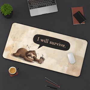 May include: A rectangular beige desk mat featuring a cartoon sloth sleeping and holding a coffee cup. The mat has the text "I will survive" in a speech bubble. A laptop, mouse, and coffee cup are also visible.