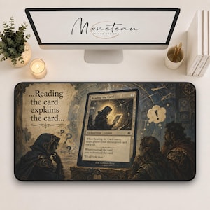 May include: A rectangular desk mat featuring a fantasy-themed illustration of a large game card centered with the text Reading the card explains the card. The artwork depicts hooded figures observing the card, with a speech bubble containing an exclamation point.