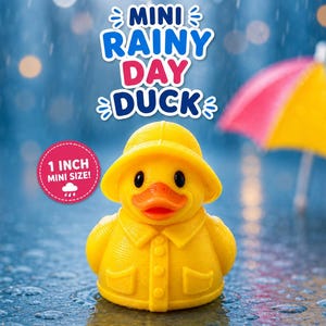 May include: A yellow rubber duck wearing a yellow rain hat and raincoat, featuring an orange beak. A pink circular badge states 1 INCH MINI SIZE! Text above reads MINI RAINY DAY DUCK. A colorful umbrella is visible in the background.