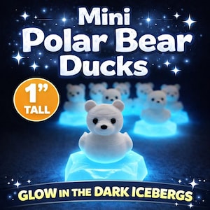 May include: A group of mini polar bear ducks, each 1 inch tall, on glowing blue icebergs. The text reads "Mini Polar Bear Ducks" and "Glow in the Dark Icebergs". The bears are white with black eyes and noses.