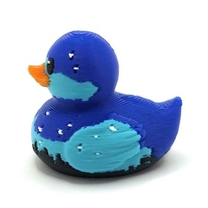 Mini Northern Lights Duck with aurora borealis design, 1 inch tall 3D printed cruise duck, blue and teal Alaska-inspired mini duck with snowy winter background, exclusive handmade duck collectible for cruise hiding and duck exchanges. Perfect for Alaska cruises and alaska gifts.  3D printed with PLA plastic.