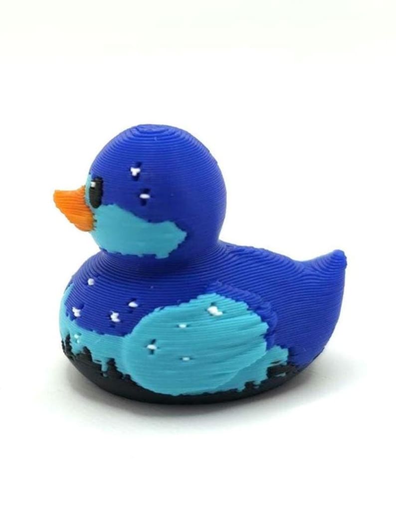 Mini Northern Lights Duck with aurora borealis design, 1 inch tall 3D printed cruise duck, blue and teal Alaska-inspired mini duck with snowy winter background, exclusive handmade duck collectible for cruise hiding and duck exchanges. Perfect for Alaska cruises and alaska gifts.  3D printed with PLA plastic.