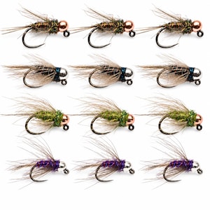 May include: A collection of twelve fishing flies arranged in four rows of three. Each fly features a metal hook, a metallic bead head in copper or silver, and a body wrapped in colourful thread with fine, wispy brown hackle fibres extending outward.