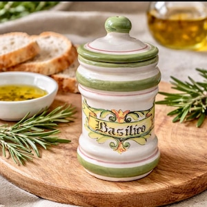 May include: A set of three ceramic mugs with a speckled, matte finish. The mugs are in shades of cream, light gray, and dark gray. Each mug has a simple, minimalist design and a rounded handle.