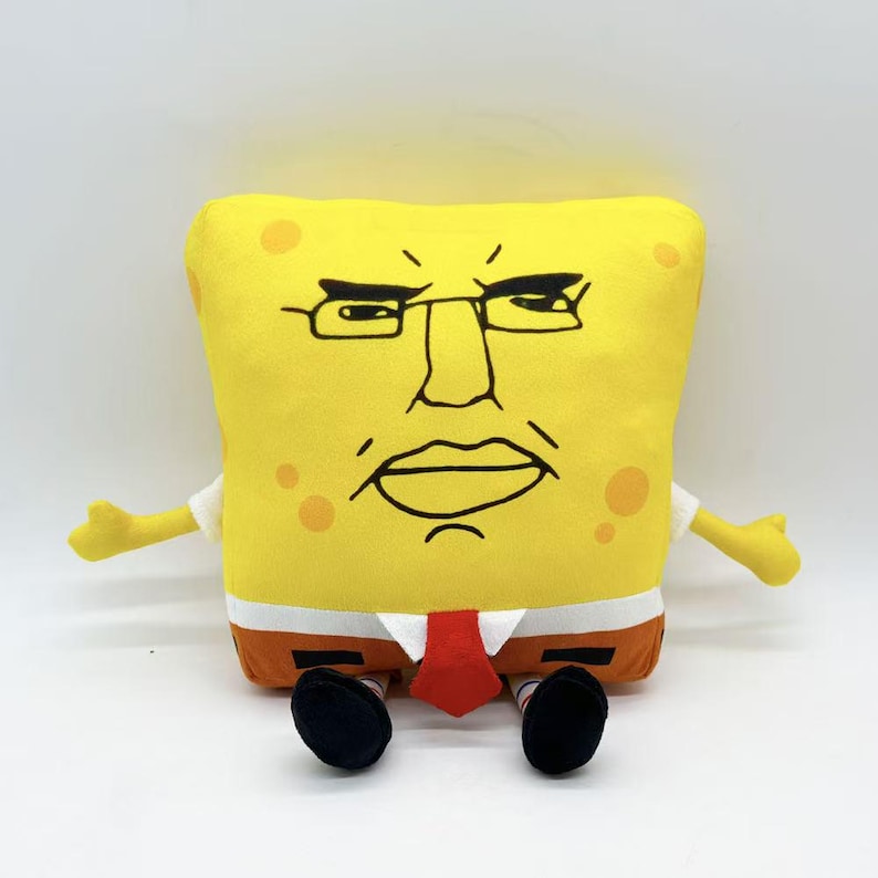 May include: A yellow plush toy shaped like SpongeBob SquarePants with an angry expression. The toy has black-rimmed glasses, a red tie, and brown pants. The arms and legs are outstretched, and the toy is sitting.