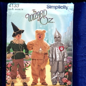 simplicity 4133 Der Zauberer von Oz Kostüme für Kinder Vogelscheuche Feiger Löwe und The Tinman Größen 3 bis 8 Kinder ungeschnitten