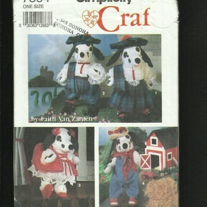 May include: Simplicity Craft pattern featuring Dalmatian dog plushies in various outfits. The dogs have black spots, floppy ears, and are dressed in outfits like a kilt, overalls, and a red dress. The pattern includes the text "7864 ONE SIZE".