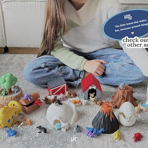 May include: A collection of colorful, printed toy sets, including a submarine, volcano, tree stump, and a red barn. The image includes the text "Little Printy Co." and "check out our other sets!"