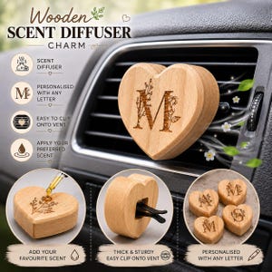 May include: Wooden heart-shaped scent diffuser charm with the letter "M" engraved on the front. The charm is designed to clip onto a car vent and can be personalized with any letter. The image also shows how to add your favorite scent.