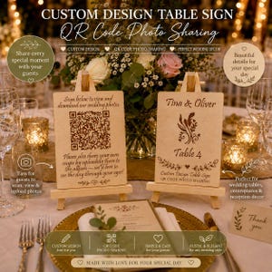 May include: Two rectangular wooden table signs displayed on small wooden easels. The left sign features a QR code with text instructing guests to scan, view, and download wedding photos. The right sign displays the names Tina & Oliver and Table 4.