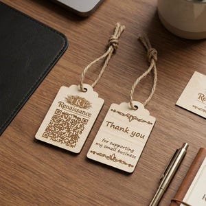 May include: Two wooden gift tags with twine strings. One tag has a QR code and the word "Renaissance". The other tag says "Thank you for supporting my small business". Both tags have decorative borders.