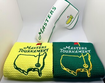 Set de regalo de golf Masters: funda blanca para putter tipo blade + 2 toallas amarillas y verdes.