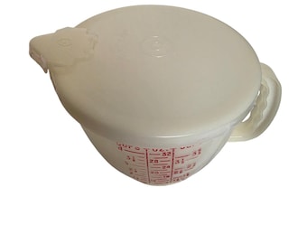 Jarra medidora Tupperware Mix-N-Stor vintage de 4 tazas (1 litro) con tapa, color rojo transparente.