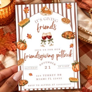 May include: A rectangular invitation card with brown and white vertical stripes featuring watercolour illustrations of pumpkin pie, roasted turkey, wine glasses, and pumpkins. Text reads: IT'S GIVING friends, JOIN US FOR OUR friendsgiving potluck, NOVEMBER 21, 324 TURKEY DR MIAMI FL 23432, RSVP TO ALYSSA AT 1240322121.