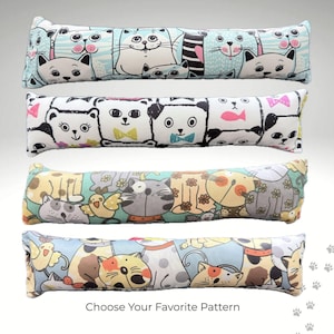 May include: Four long, rectangular cat-themed pillows with different patterns. The pillows feature various cat illustrations in pastel colors. The text "Choose Your Favorite Pattern" is at the bottom.