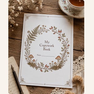 May include: A white rectangular copywork book cover featuring a central botanical wreath illustration with ferns, mushrooms, berries, and small flowers. The text My Copywork Book is printed in the center above a line for a name. The border has corner accents.