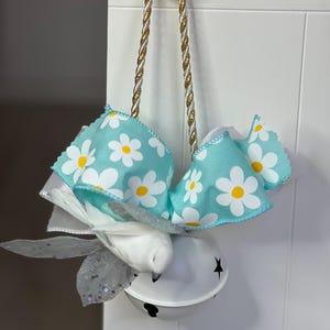 White Jingle Bell with Turquoise and White Wired Ribbons, Shimmering Leaves, Bird Accent