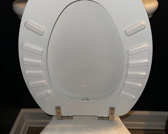 Protector de asiento de inodoro