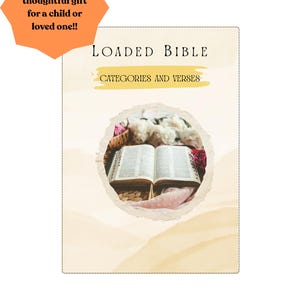 May include: An open book with the title "LOADED BIBLE" and the text "CATEGORIES AND VERSES" is displayed. The image includes an orange starburst with the text "Makes a thoughtful gift for a child or loved one!!". The book is surrounded by flowers.