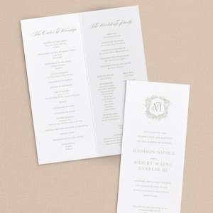 May include: Elegant wedding stationery featuring a program and a smaller card. The program lists the order of service and wedding party details. The card includes the couple's names, wedding date, and a floral monogram.
