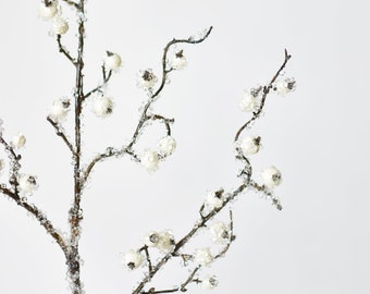 May include: A frosted twig spray with white berries, perfect for adding a touch of winter to your home decor.