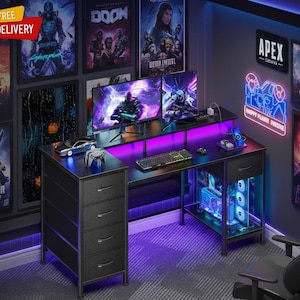 May include: A black gaming desk featuring a four-drawer storage unit on the left, a raised monitor shelf, and a lower shelf for a computer tower. The desk includes integrated purple LED lighting, a keyboard, a mouse, and a controller.