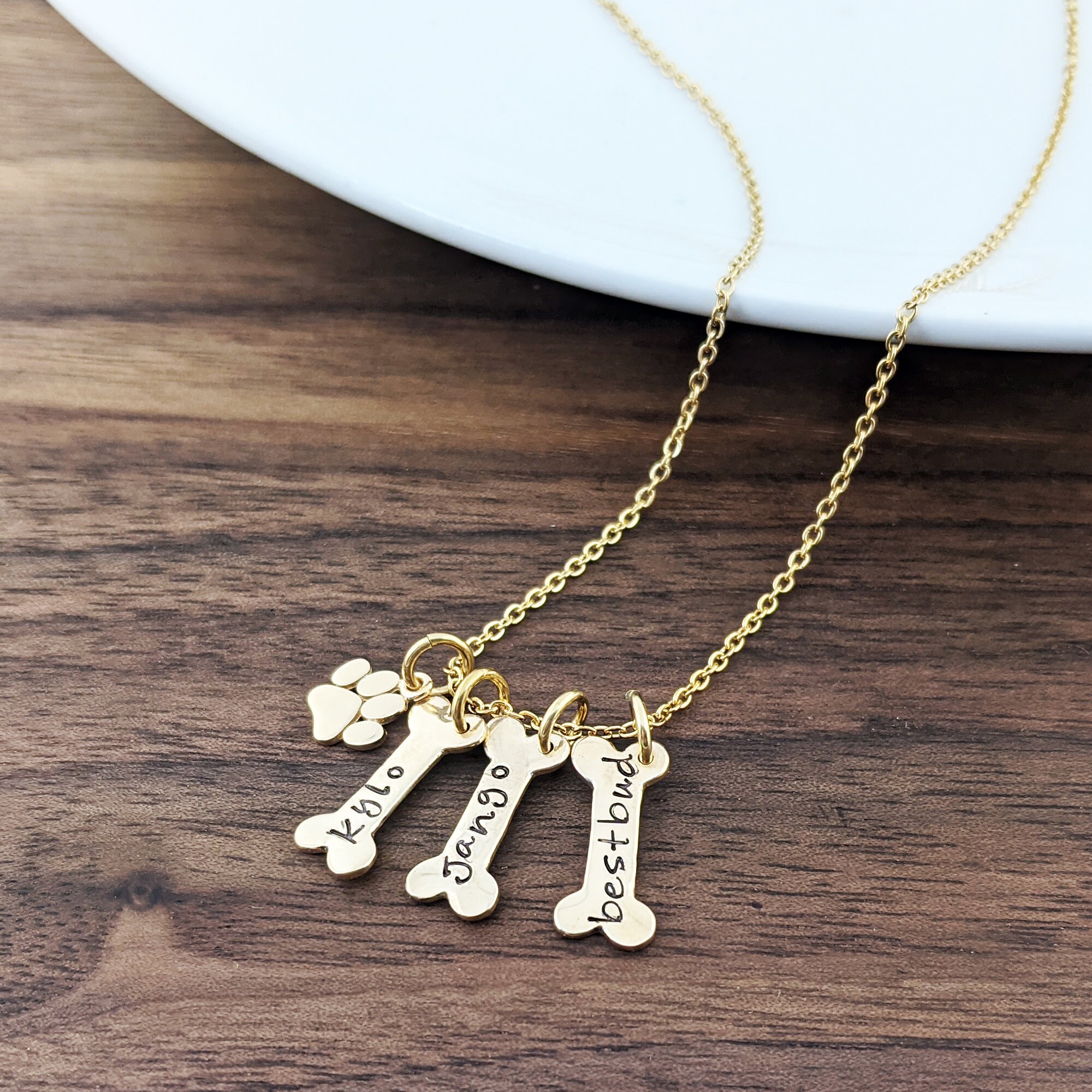 gold dog bone charm