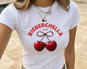 Bieberchella 2026 Baby Tee, Coquette Cherry Crop Top, Festival Outfit Y2K Graphic Tee, Ribbon Concert Shirt, Trendy Summer Fan Aesthetic